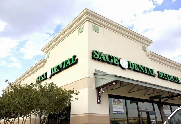 Exterior view of Sage Dental office storefront with signage and entrance awning.