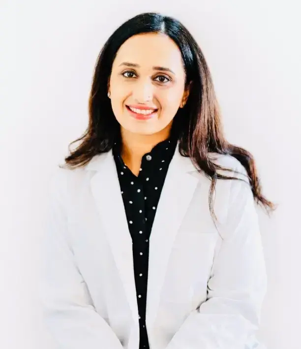Dr. Shahid, dentist at Baytown dental practice, smiling in professional portrait.